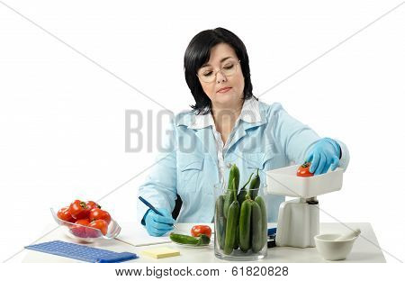 Phytosanitary Technician Weighing Red Tomato
