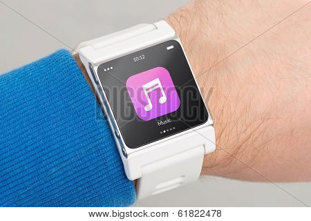 Close Up White Smart Watch With Music App Icon On The Screen
