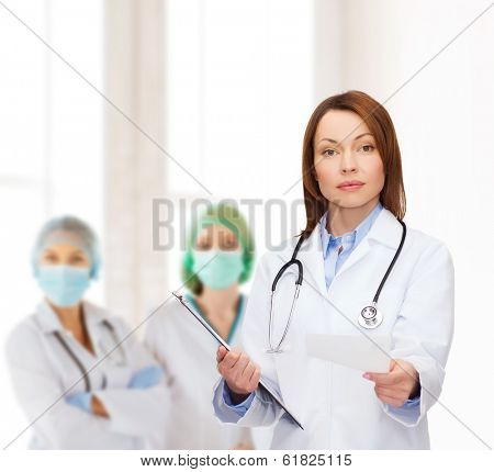 healthcare and medicine concept - calm female doctor with clipboard and stethoscope