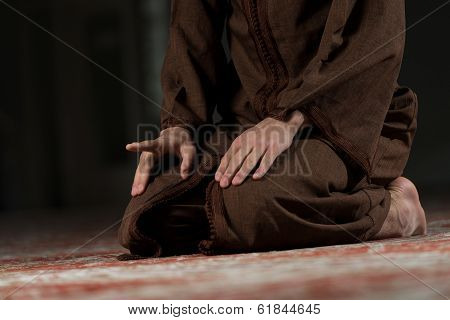 Close-up Of Male Hands Praying In Mosque