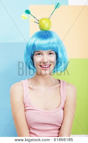 Precision. Amusing Woman In Blue Wig, Green Apple And Darts