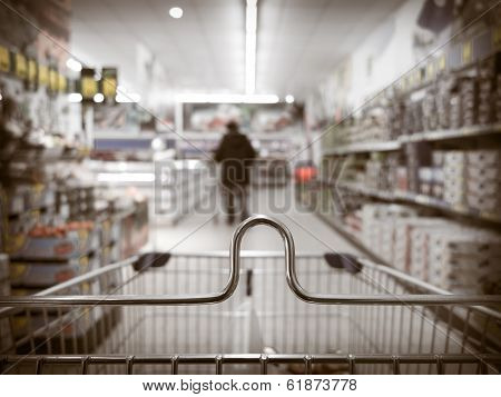 View From Shopping Cart Trolley At Supermarket Shop. Retail.
