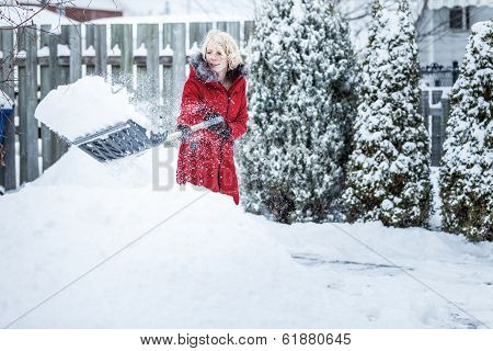 Woman Shoveling Her Parking Lot