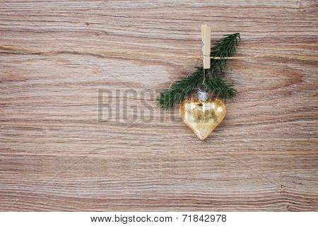 christmas golden heart with evergreen  twig
