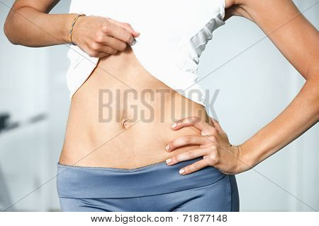 Closeup Of Young Slim Woman With Six-pack Torso.