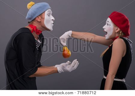 Portrait of funny mime couple with white faces and emotions isol