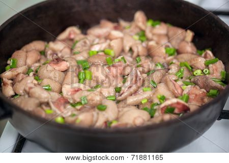 Fried luteus with green onion close-up