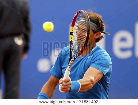 BARCELONA - APRIL, 24: Spanish tennis player Rafa Nadal in action during a match of Barcelona tennis tournament Conde de Godo on April 24, 2014 in Barcelona