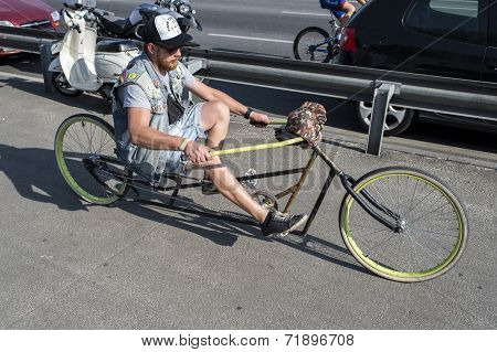 man driving bicycle chopper