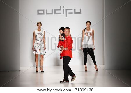 NEW YORK-SEP 8: (L-R) Danielle Knudson, designer Zhuliang Li & Miss Teen USA K. Lee Graham at OUDIFU fashion show at Mercedes-Benz Fashion Week at Lincoln Center on September 8, 2014 in New York City.