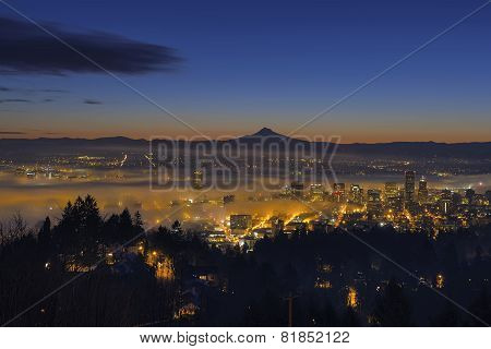 Fog Rolling In At Dawn Over The Cityscape Of Portland