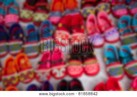Blurry Image Of Handmade Kid Shoe