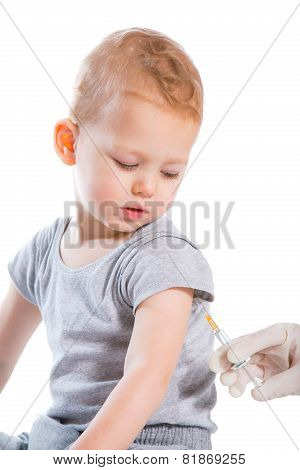 The doctor makes a baby vaccination on a white background.