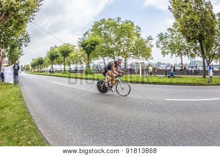 An Athlete Cycles In The Cologne Triathlon