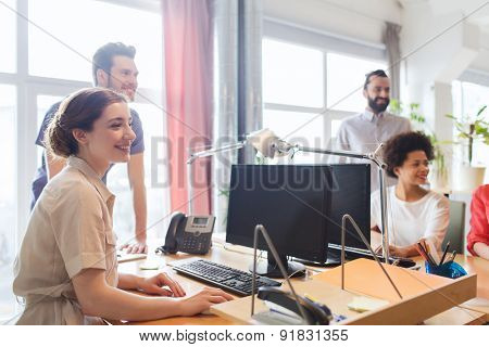 business, startup and people concept - happy creative team in office