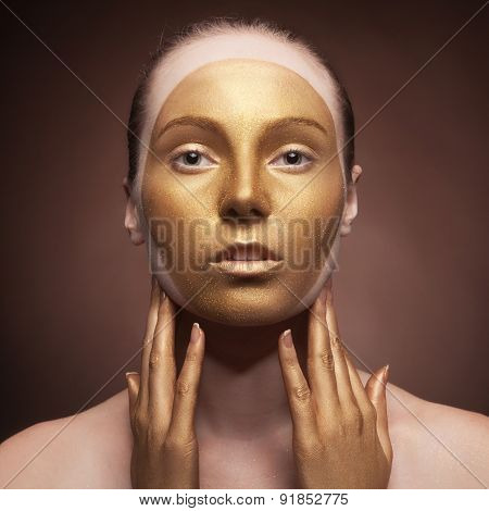 Woman With Fashion Art Make Up On Brown Background