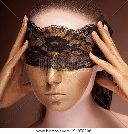 Sensual Woman With A Lace On Face