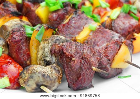 Grilled Beef Cabobs, Mushrooms And Vegetables On The Dish