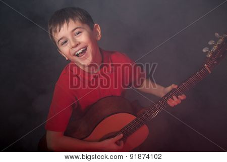 Happy Singing Boy With Guitar