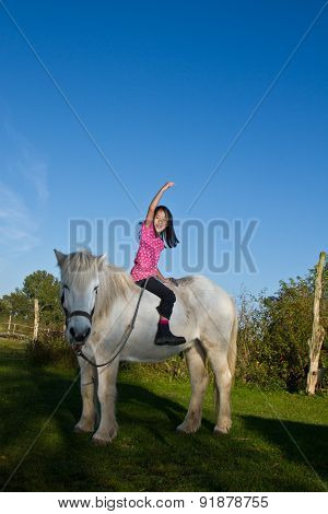 Girl Ridding A White Horse In Denmark