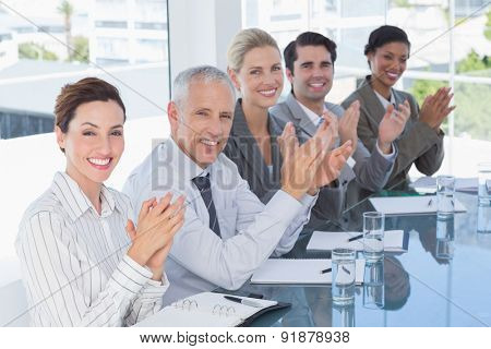 Business team applauding during conference in the office