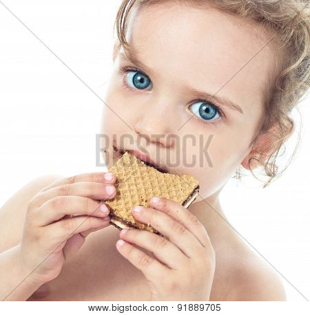 Beautiful Sweet  Little Girl Eating A Cookie