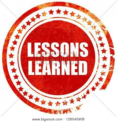 lessons learned, grunge red rubber stamp on a solid white backgr