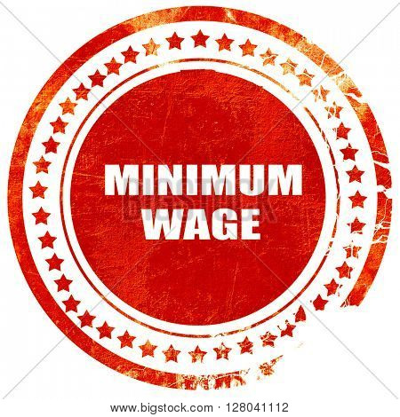 minimum wage, grunge red rubber stamp on a solid white backgroun