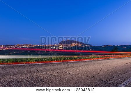 a light trail in country road in Italy