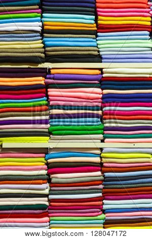 colorful fabric rolls the stacked in the shop