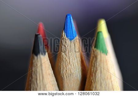 Close-up picture of color pencils on black background