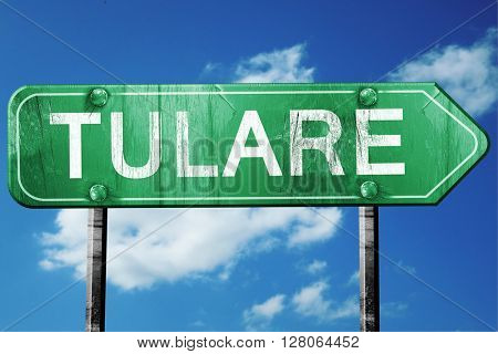 tulare road sign , worn and damaged look