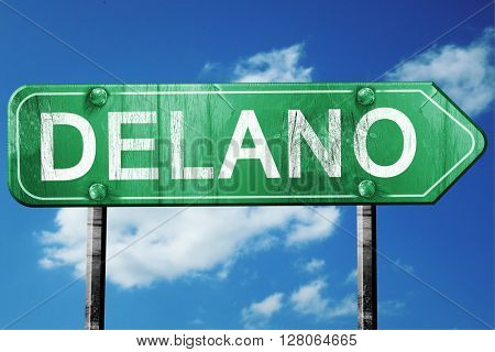 delano road sign , worn and damaged look