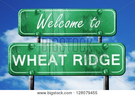 wheat ridge vintage green road sign with blue sky background