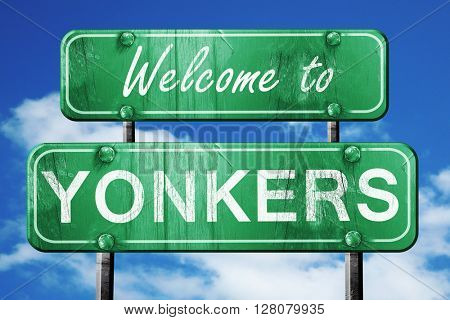 yokane vintage green road sign with blue sky background