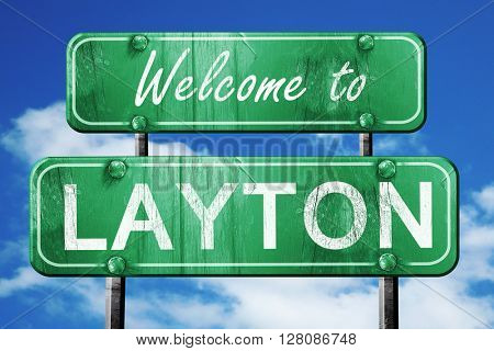 layton vintage green road sign with blue sky background
