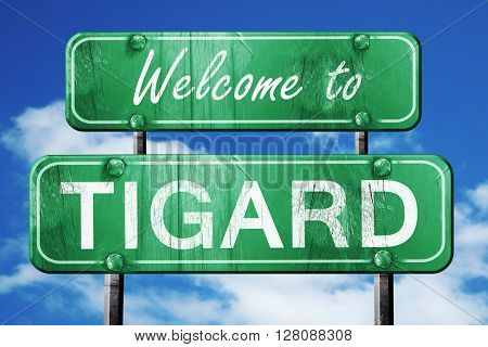 tigard vintage green road sign with blue sky background