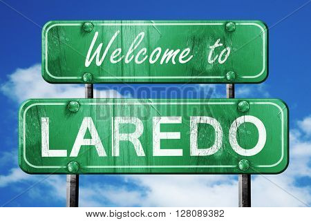 laredo vintage green road sign with blue sky background