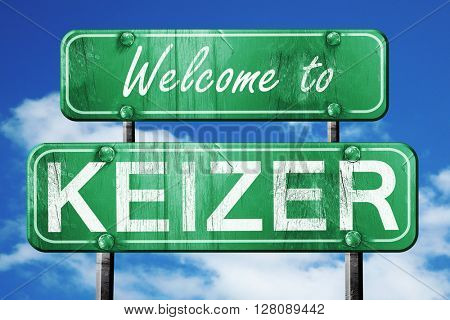 keizer vintage green road sign with blue sky background