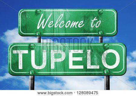 tupelo vintage green road sign with blue sky background