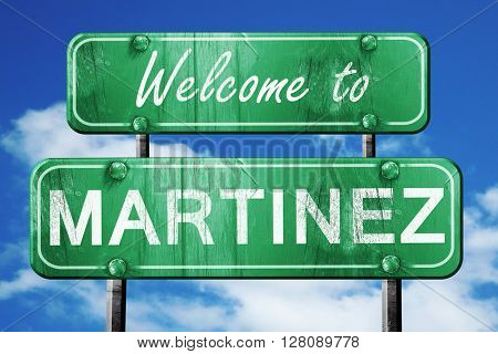 martinez vintage green road sign with blue sky background