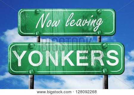 Leaving yokane, green vintage road sign with rough lettering