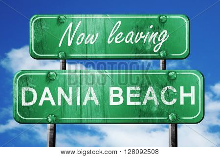 Leaving dania beach, green vintage road sign with rough letterin