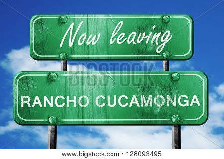 Leaving rancho cucamonga, green vintage road sign with rough let