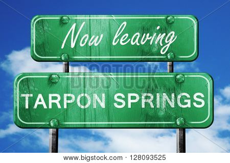 Leaving tarpon springs, green vintage road sign with rough lette