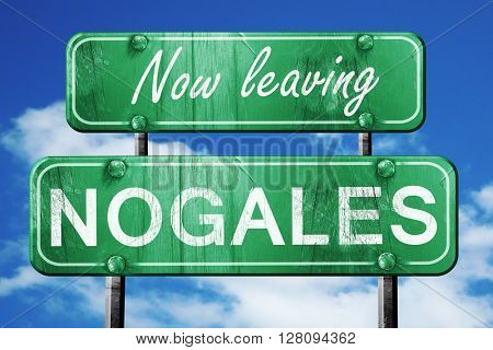 Leaving nogales, green vintage road sign with rough lettering