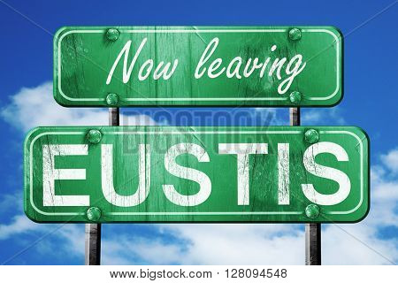 Leaving eustis, green vintage road sign with rough lettering