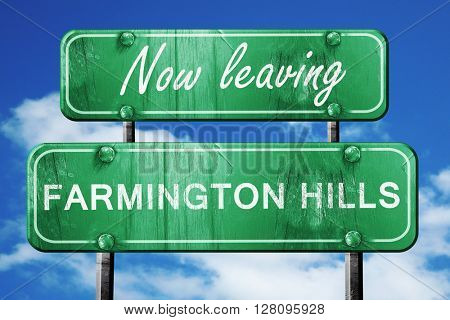 Leaving farmington hills, green vintage road sign with rough let