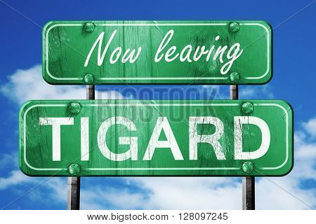 Leaving tigard, green vintage road sign with rough lettering