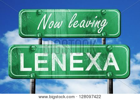 Leaving lenexa, green vintage road sign with rough lettering